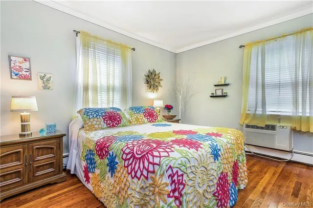 a bedroom with a bed and a dresser in it