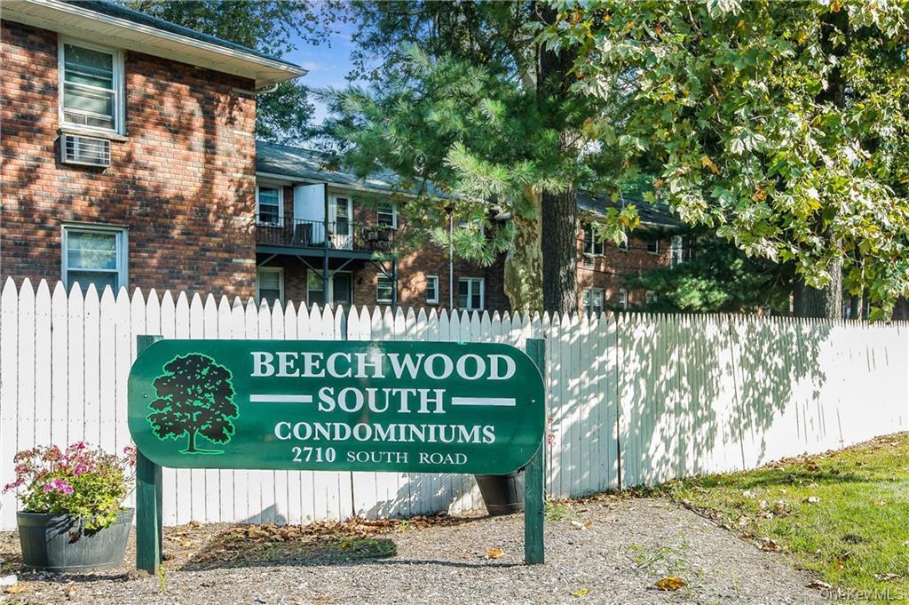 2710 South Road, Unit F11 Poughkeepsie, NY 12601 - Photo 8 of 10 a sign on the side of a building