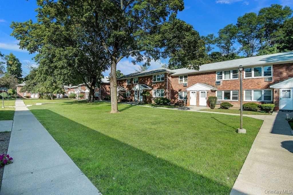 2710 South Road, Unit F11 Poughkeepsie, NY 12601 - Photo 9 of 10 a front view of a house with a yard