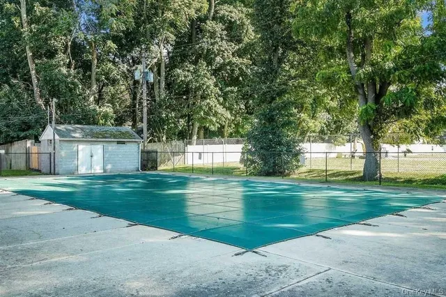 a garden with trees in front of it