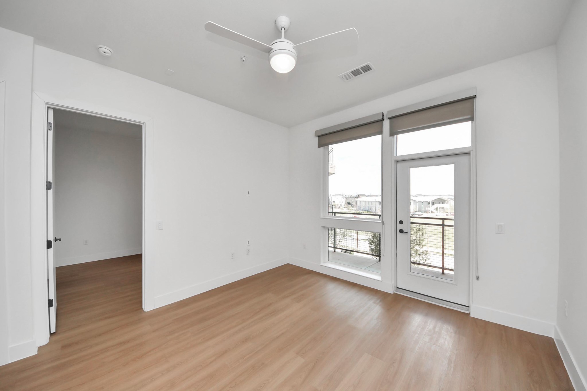 2810 Riverby Road, Unit 119 Houston, TX 77020 - Photo 11 of 38 wooden floor in an empty room with a window