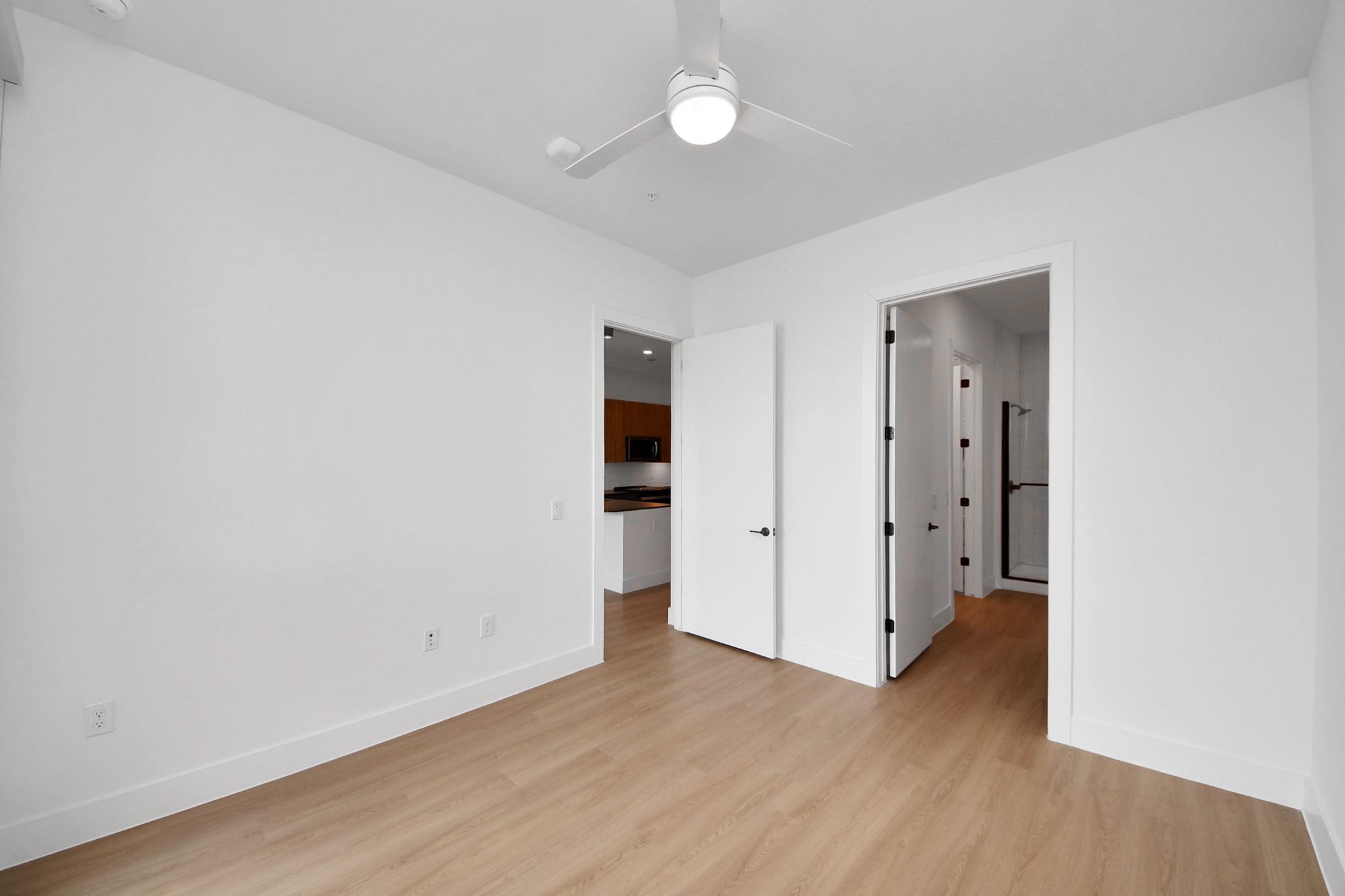 2810 Riverby Road, Unit 119 Houston, TX 77020 - Photo 14 of 38 an empty room with wooden floor and window