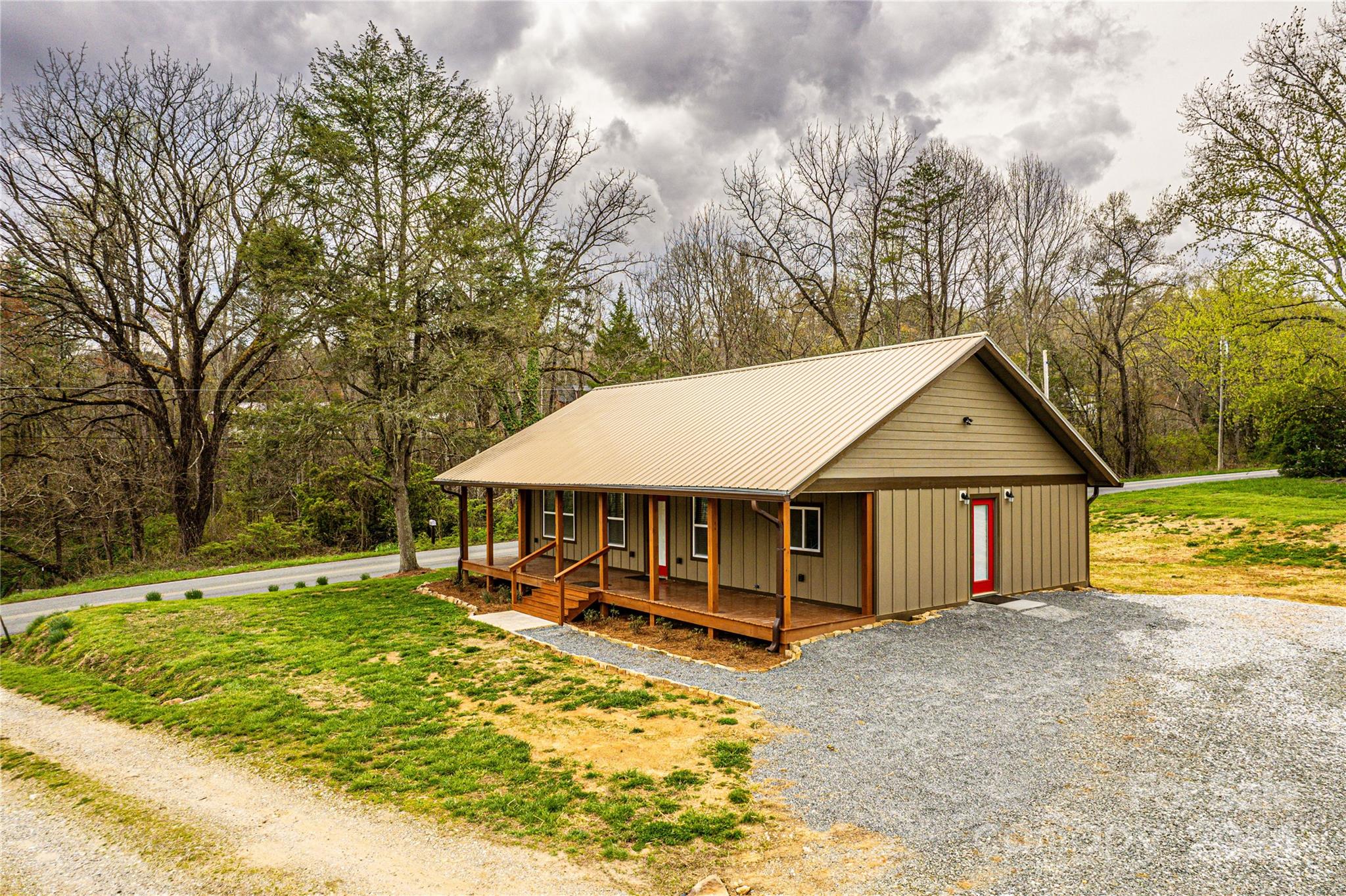 1233 Bryson Branch Road Bryson City, NC 28713 - Photo 1 of 28 a view of a house with a yard patio and tree