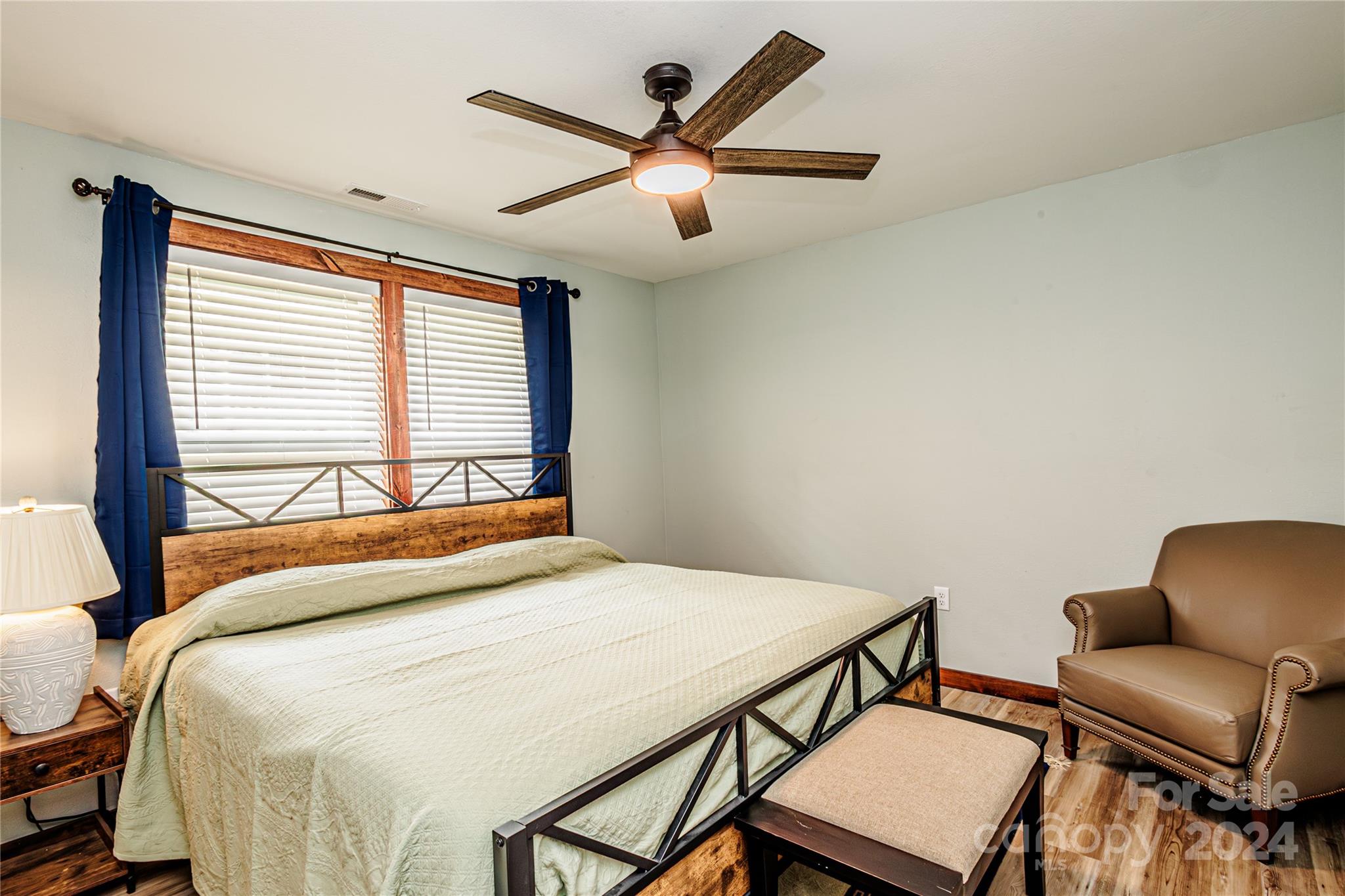 1233 Bryson Branch Road Bryson City, NC 28713 - Photo 14 of 28 a bedroom with a bed a window and a desk