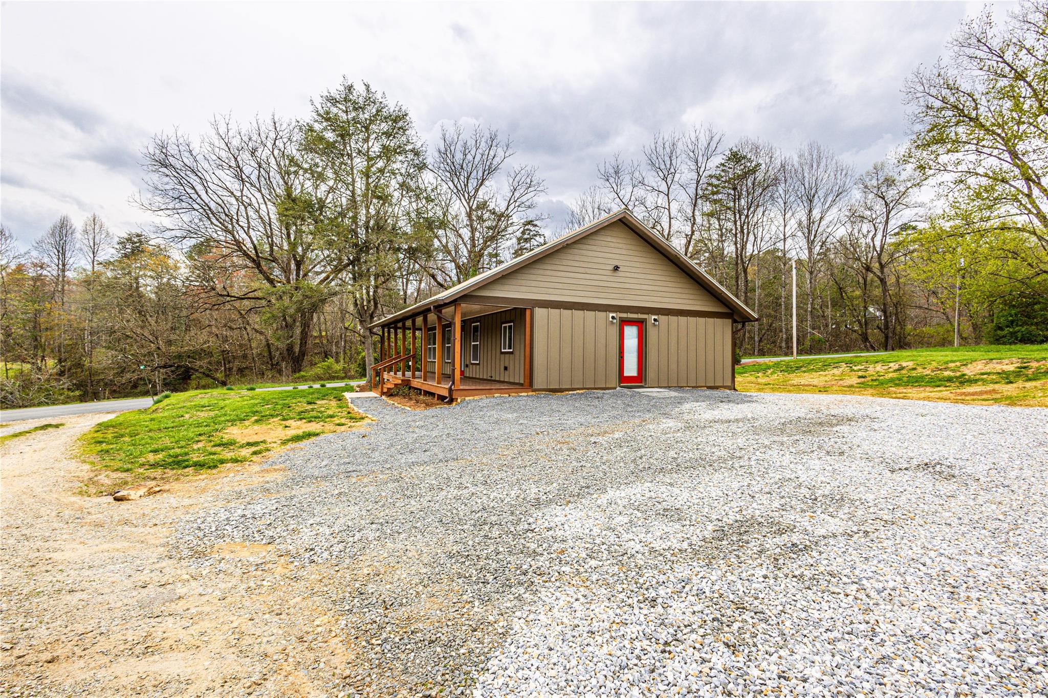 1233 Bryson Branch Road Bryson City, NC 28713 - Photo 20 of 28 a front view of a house with a yard and trees