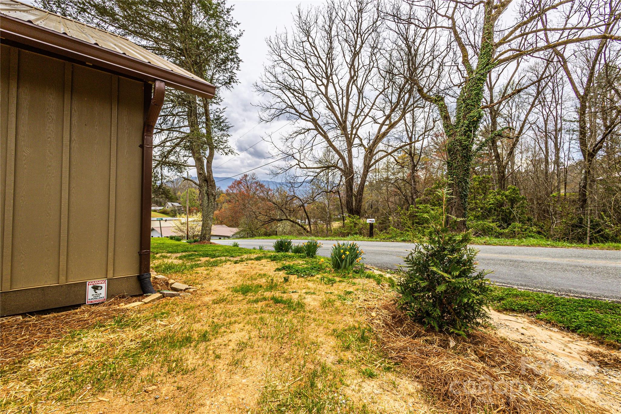1233 Bryson Branch Road Bryson City, NC 28713 - Photo 23 of 28 a backyard of a house with yard and outdoor seating