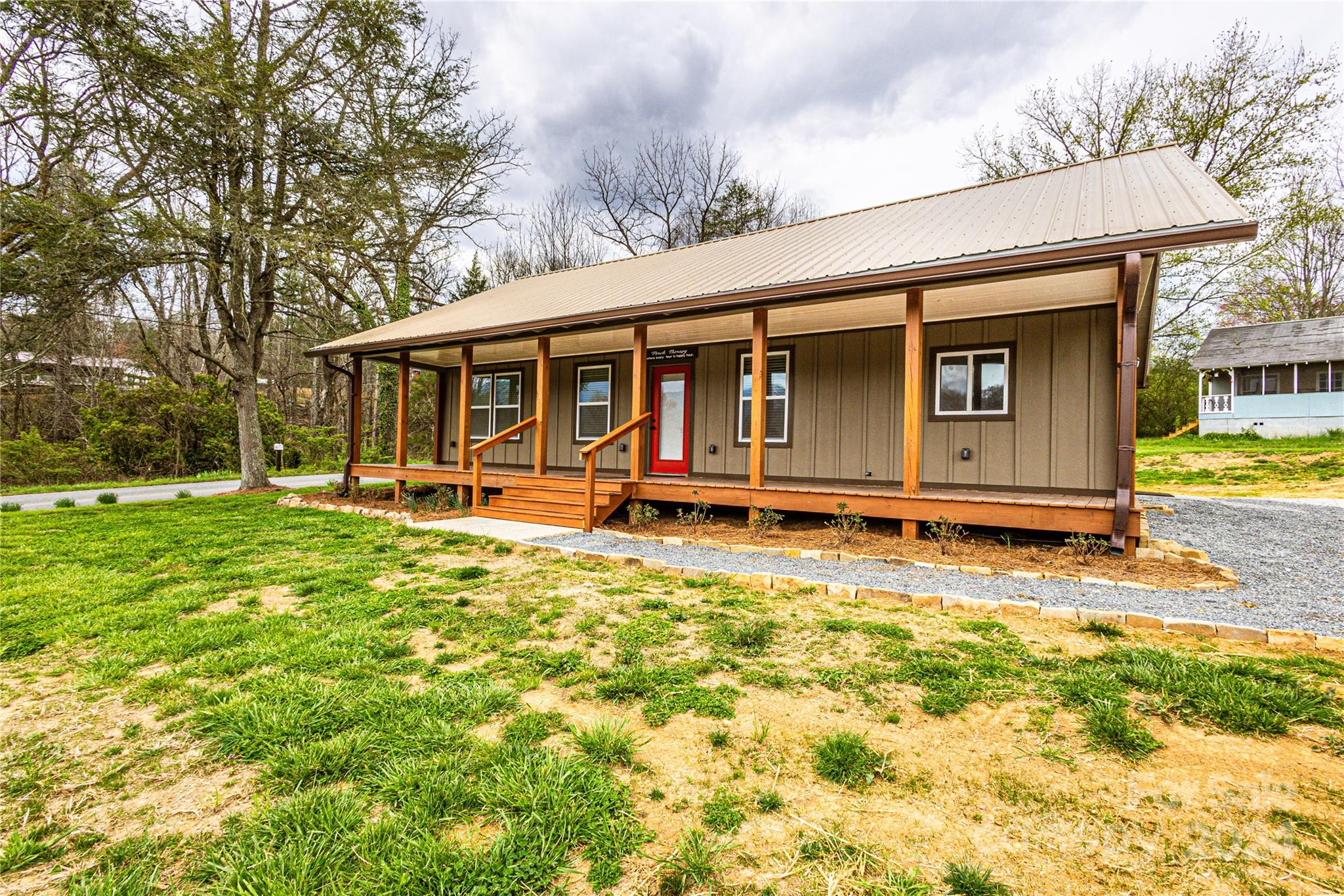 1233 Bryson Branch Road Bryson City, NC 28713 - Photo 25 of 28 a backyard of a house with yard table and chairs
