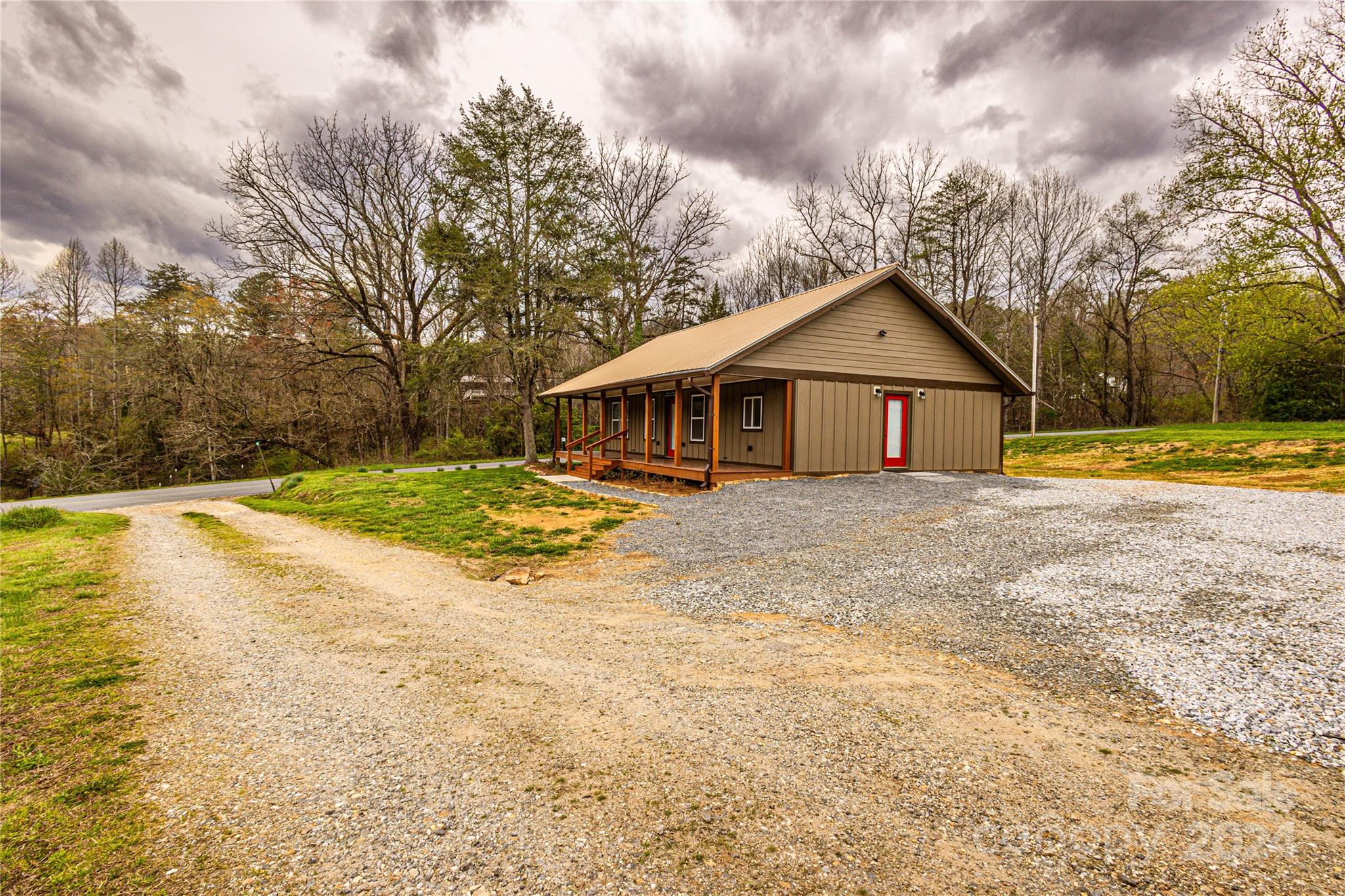 1233 Bryson Branch Road Bryson City, NC 28713 - Photo 27 of 28 a view of a house with a yard covered with snow in front of house