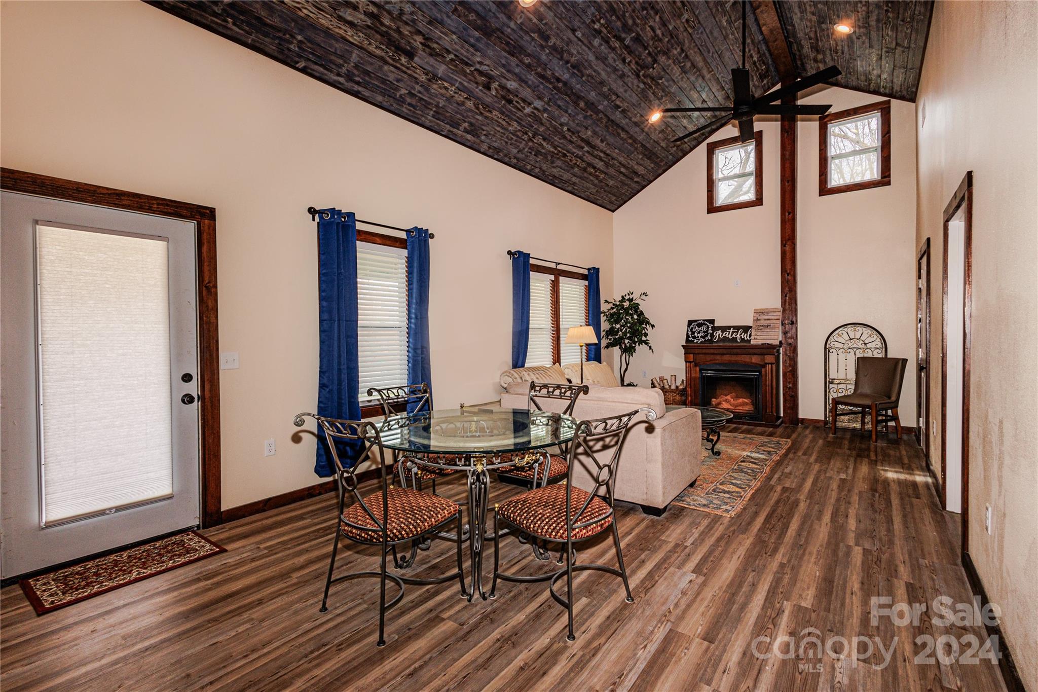 1233 Bryson Branch Road Bryson City, NC 28713 - Photo 3 of 28 a view of a dining room with furniture window and wooden floor