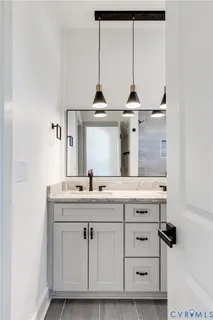 a view of cabinets a sink and dishwasher with wooden floor