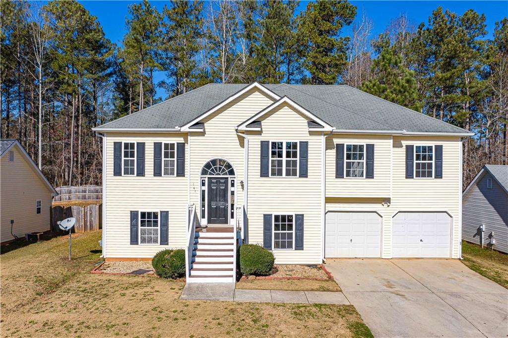 141 Whetstone Way Villa Rica, GA 30180 - Photo 1 of 1 a view of a yard in front of house