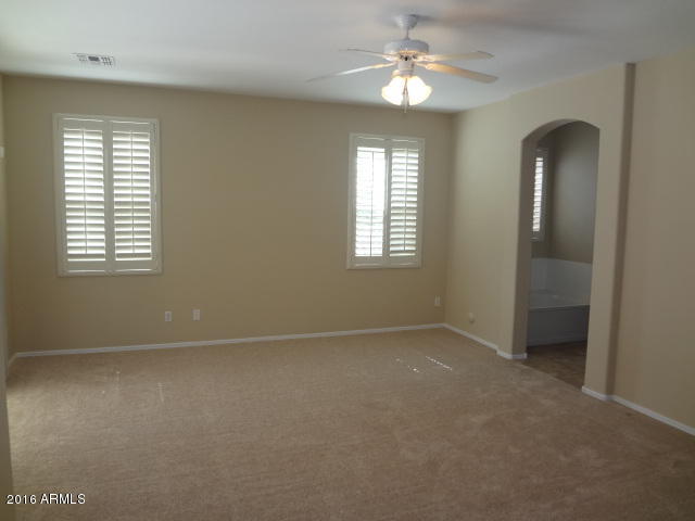 6837 West Carson Road Laveen, AZ 85339 - Photo 11 of 21 a view of an empty room with a window