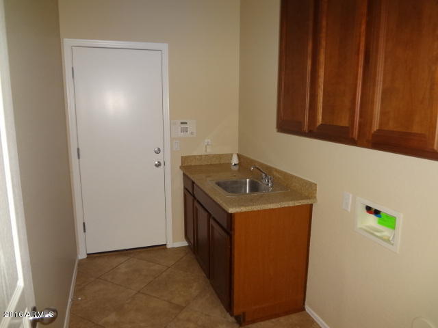 6837 West Carson Road Laveen, AZ 85339 - Photo 7 of 21 a utility room with a sink