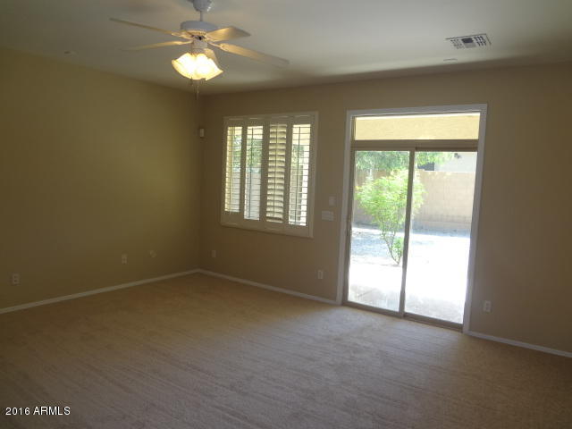 6837 West Carson Road Laveen, AZ 85339 - Photo 9 of 21 an empty room with a window