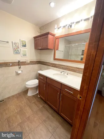 a bathroom with a sink a toilet and bathtub