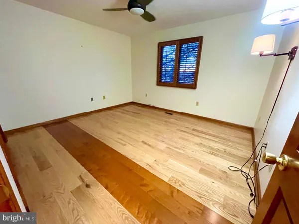 a view of a room with a air conditioner and a window