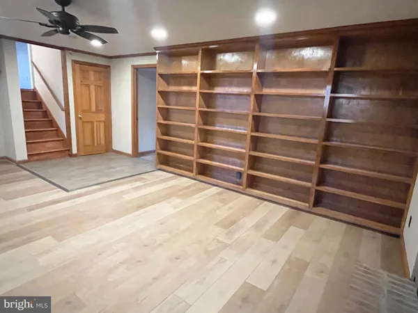 a view of an empty room with empty shelves
