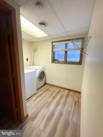 a view of a storage & utility room with a sink