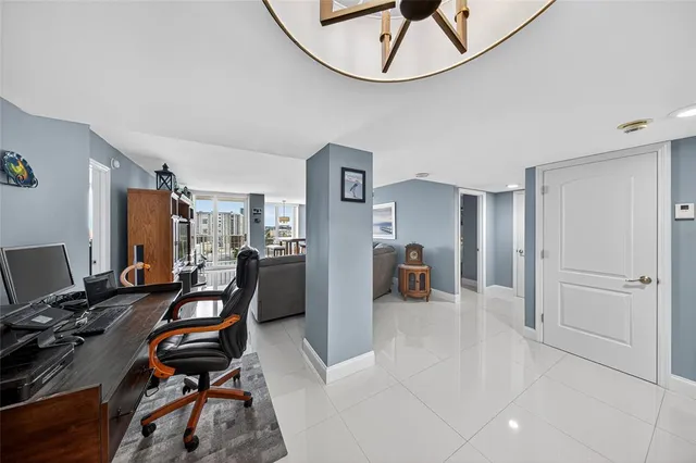 a view of a swimming pool with outdoor seating