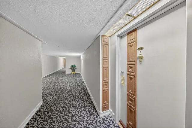 a kitchen with stainless steel appliances granite countertop a stove and cabinets