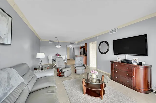 a bed room with a bed and a chair