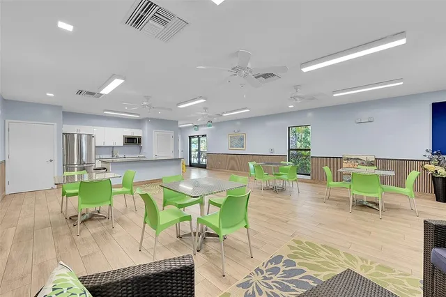 a view of a chairs and table in the backyard