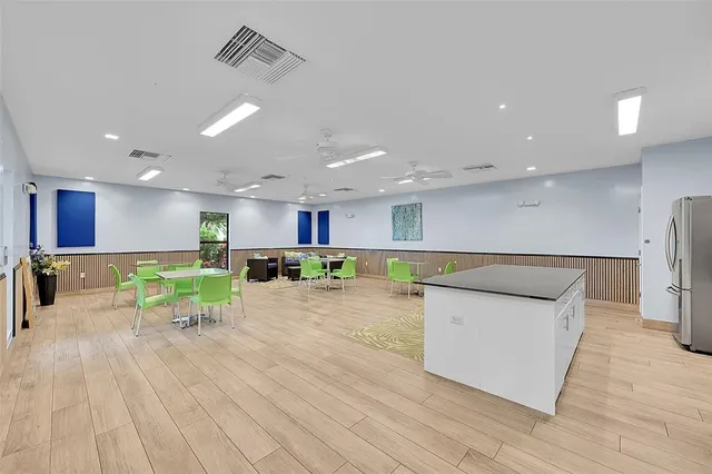 a view of backyard with outdoor seating and green space