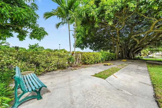 a view of a playground and basketball court