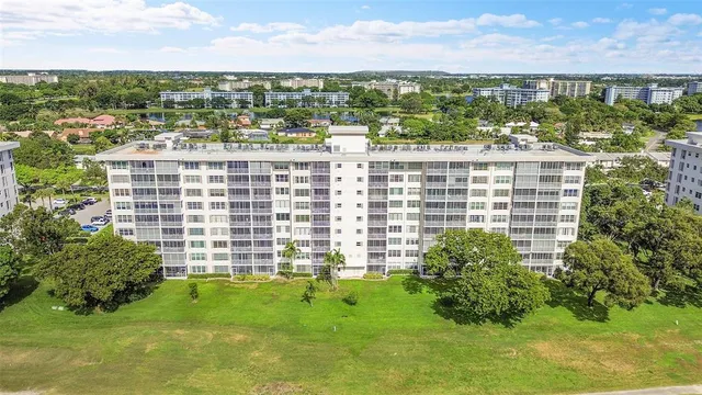 a view of swimming pool is middle in the garden