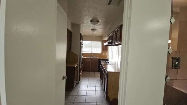 a hallway with a washer and dryer