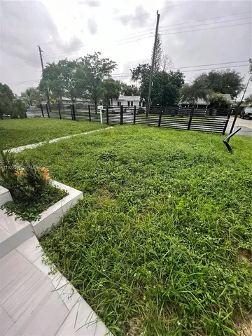 a view of a park with large trees