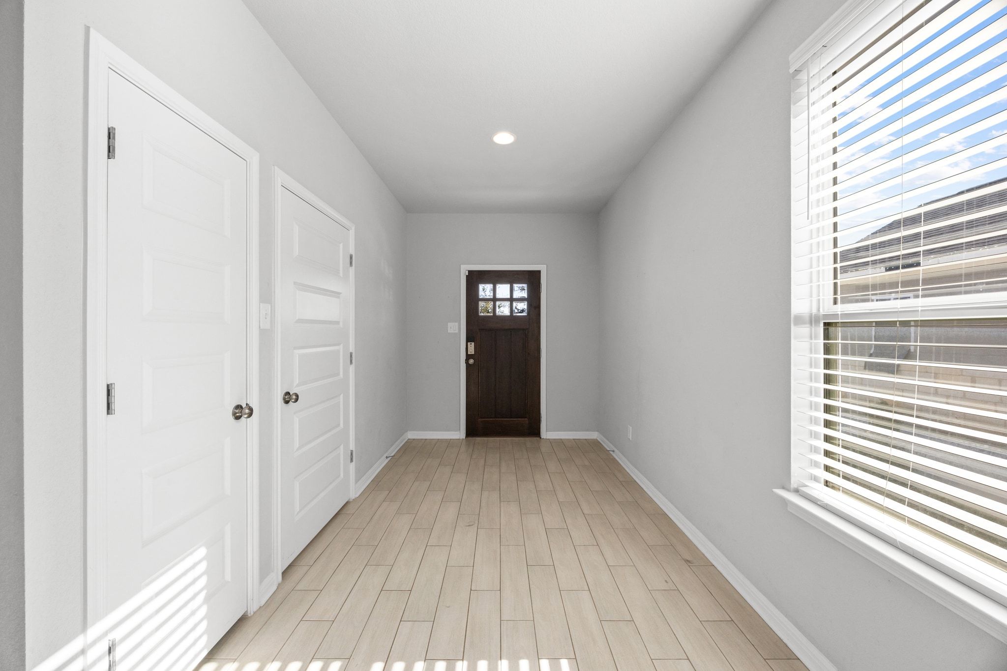 225 Unforgiven Lane Jarrell, TX 76537 - Photo 4 of 30 Entrance foyer featuring wood tiled floors and recessed lighting