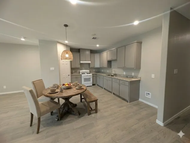 a kitchen with a table and chairs in it