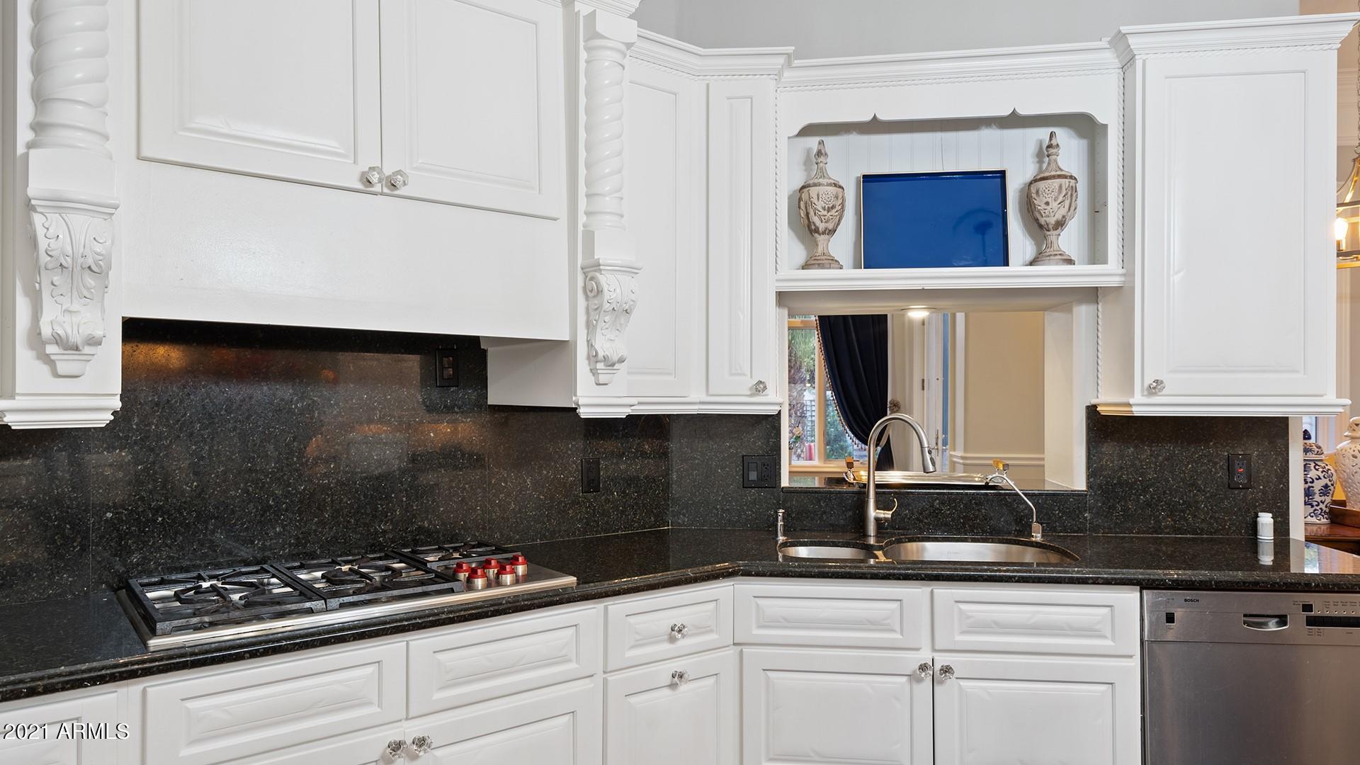 4040 East McLellan Road, Unit 8 Mesa, AZ 85205 - Photo 26 of 105 a kitchen with granite countertop white cabinets and white appliances