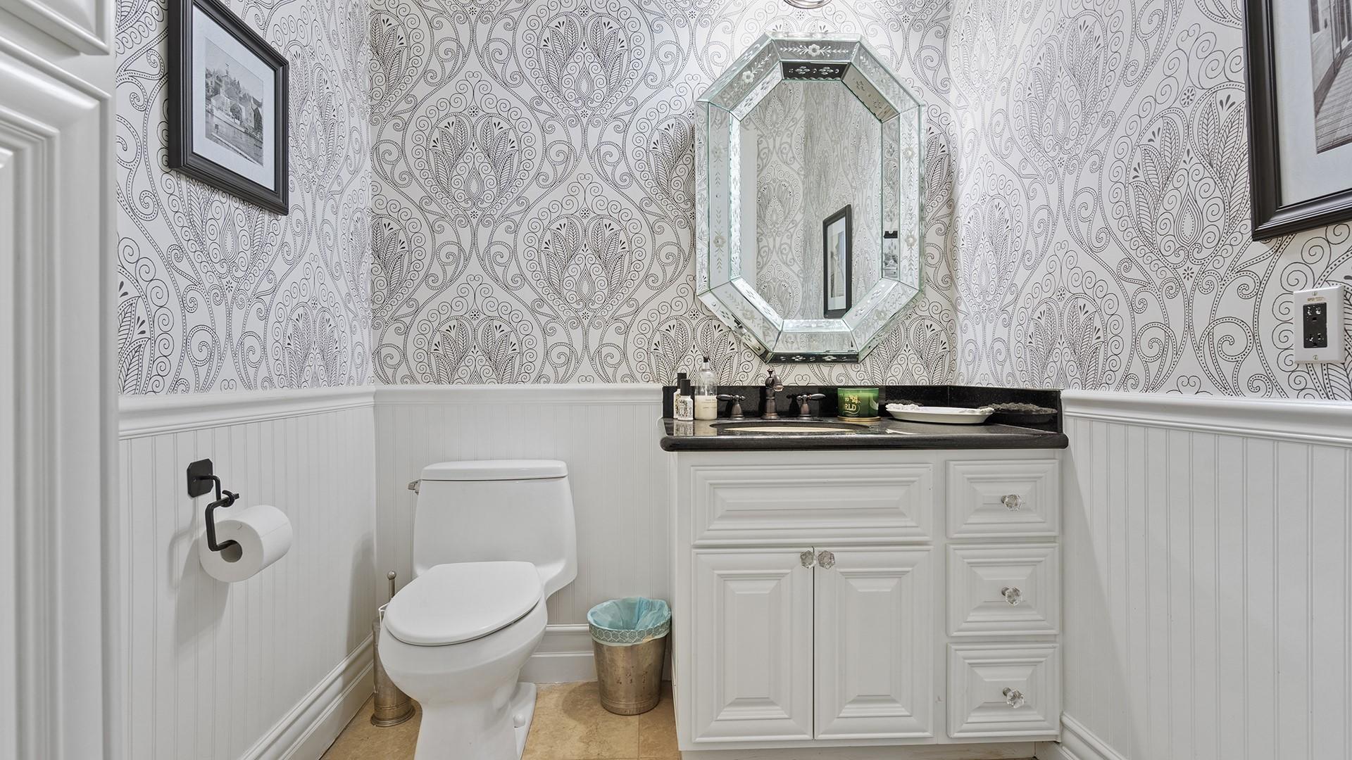 4040 East McLellan Road, Unit 8 Mesa, AZ 85205 - Photo 38 of 105 a bathroom with a toilet a sink and mirror