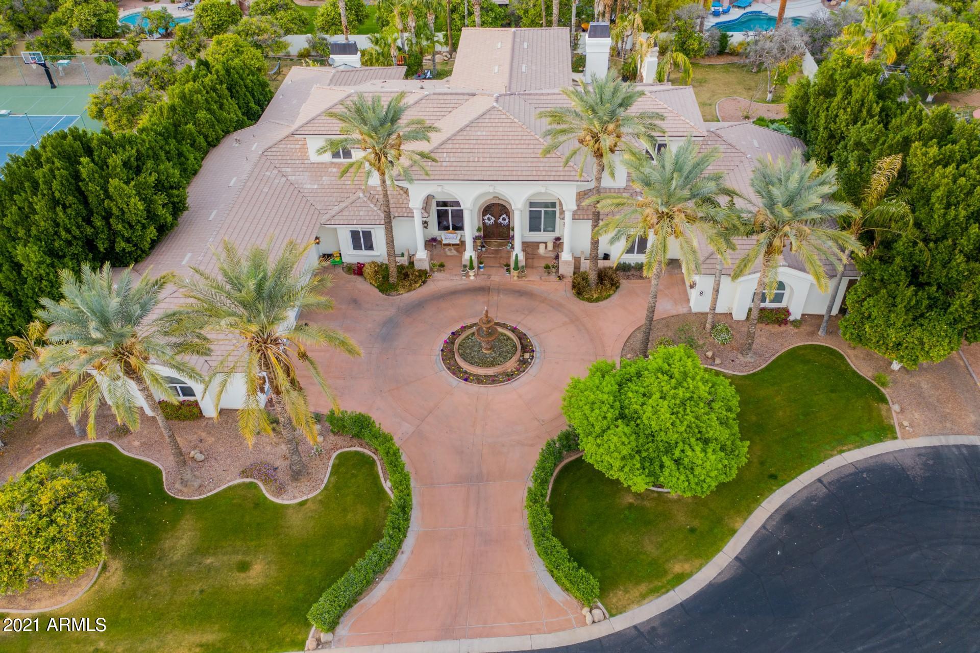 4040 East McLellan Road, Unit 8 Mesa, AZ 85205 - Photo 4 of 105 an aerial view of a house with swimming pool and garden