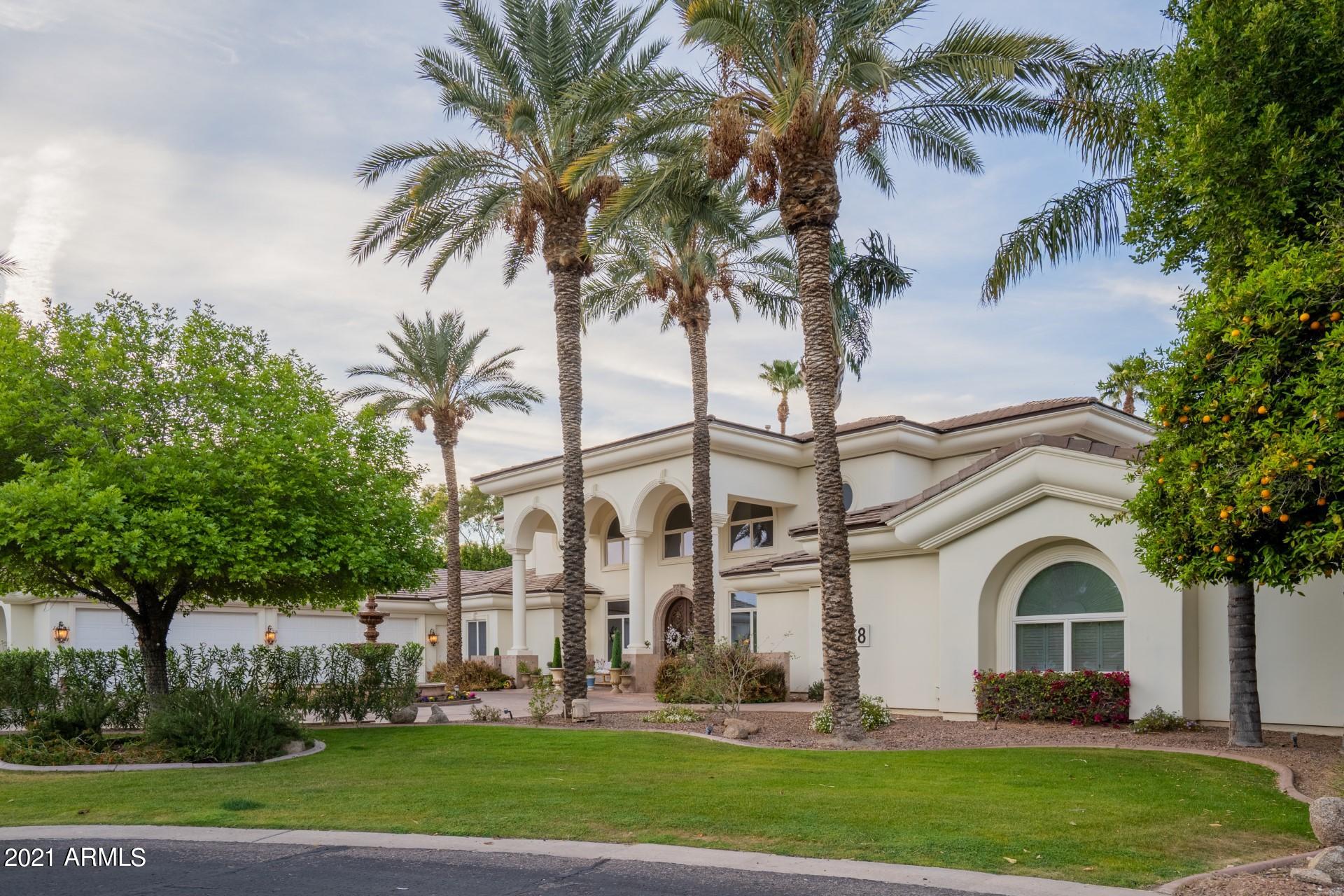 4040 East McLellan Road, Unit 8 Mesa, AZ 85205 - Photo 63 of 105 a front view of a house with garden and trees
