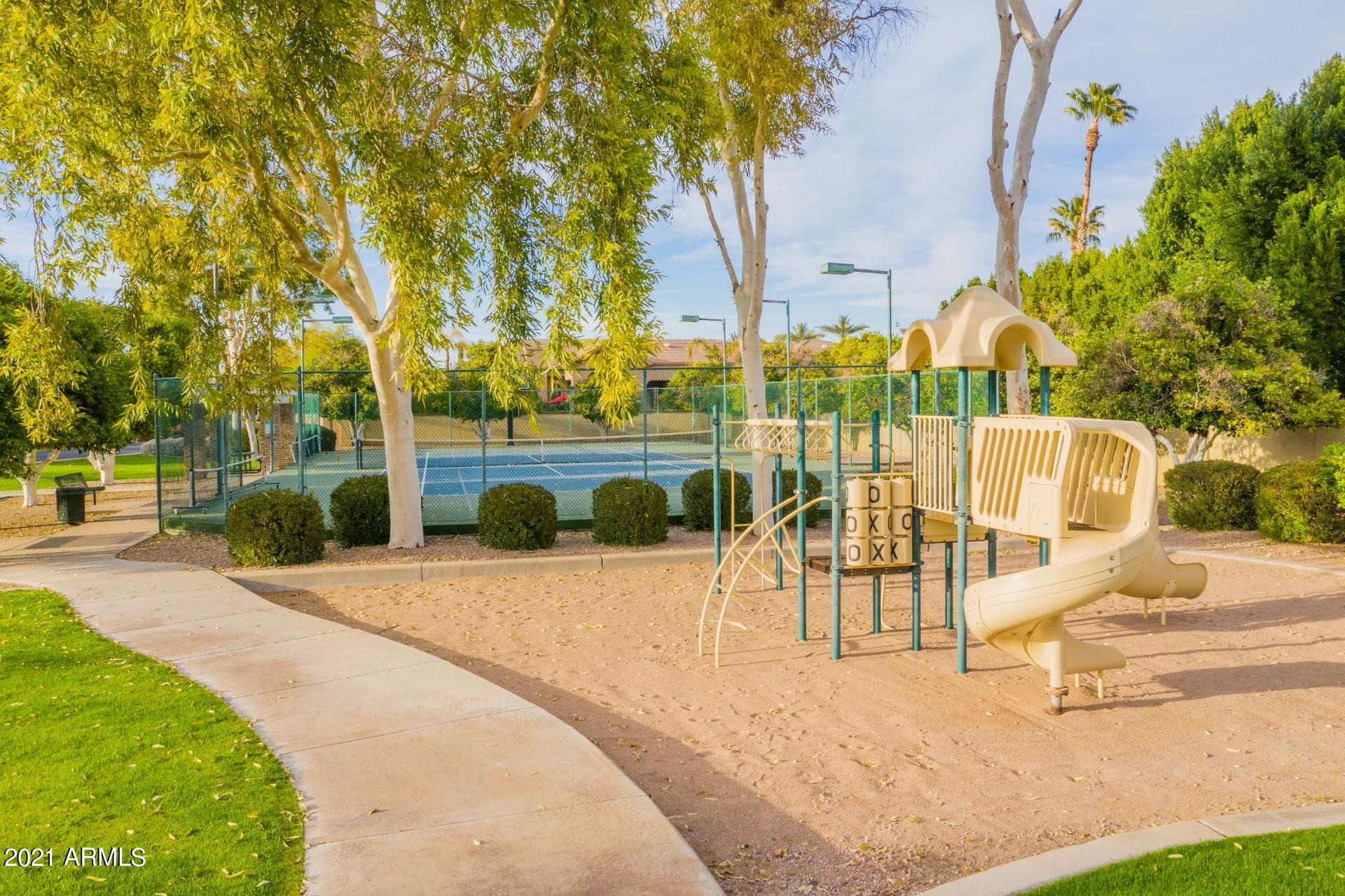 4040 East McLellan Road, Unit 8 Mesa, AZ 85205 - Photo 68 of 105 a view of a swimming pool with a patio and a yard