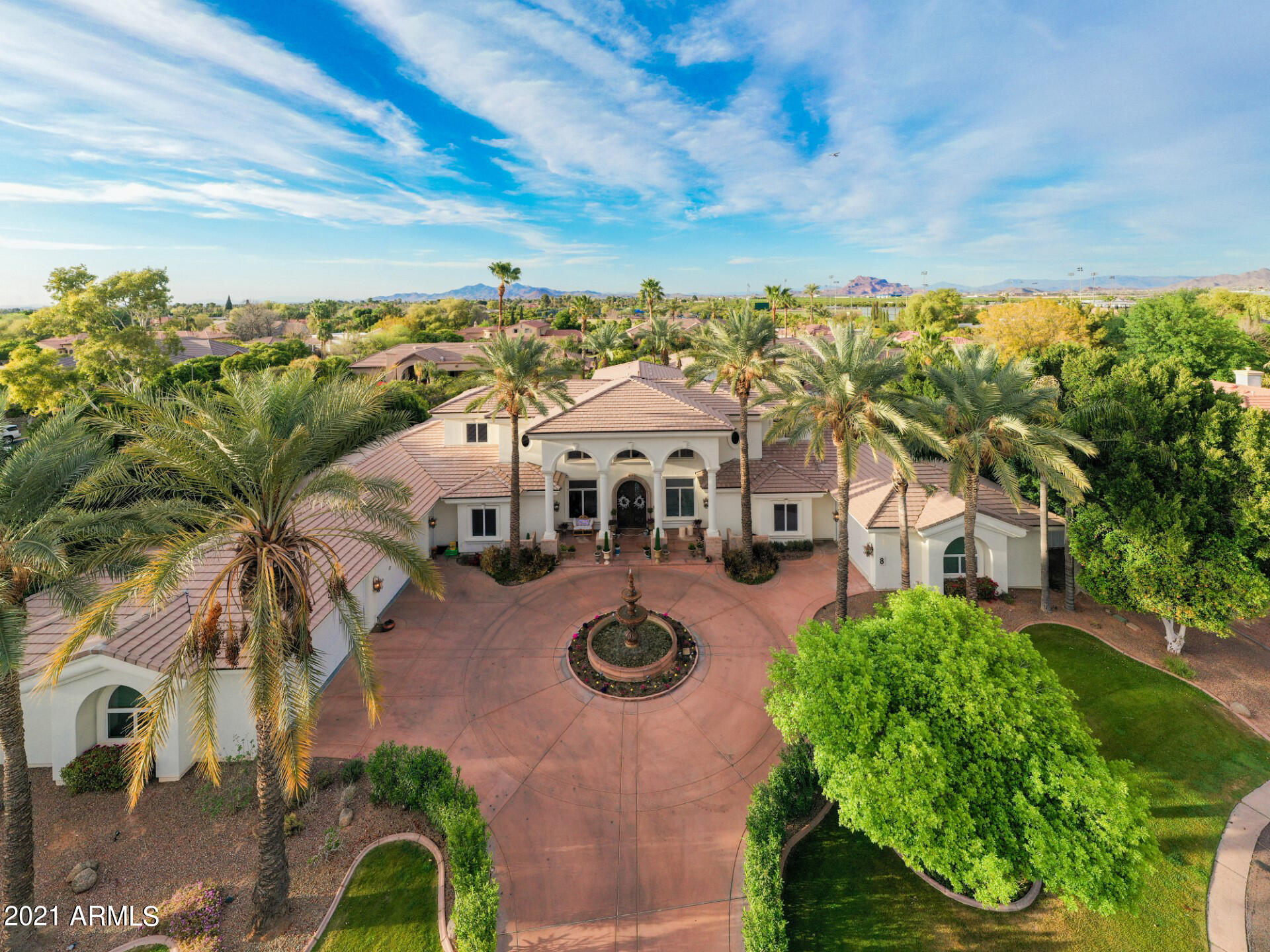4040 East McLellan Road, Unit 8 Mesa, AZ 85205 - Photo 7 of 105 an aerial view of a house with swimming pool and large trees