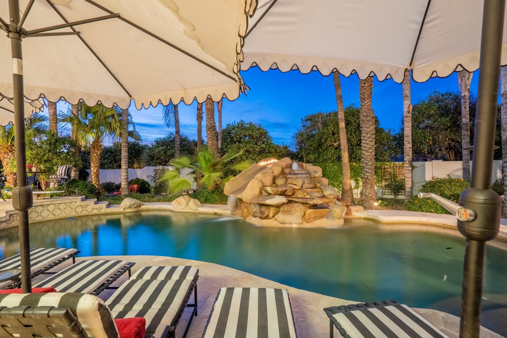 4040 East McLellan Road, Unit 8 Mesa, AZ 85205 - Photo 84 of 105 a view of a house with pool and sitting area