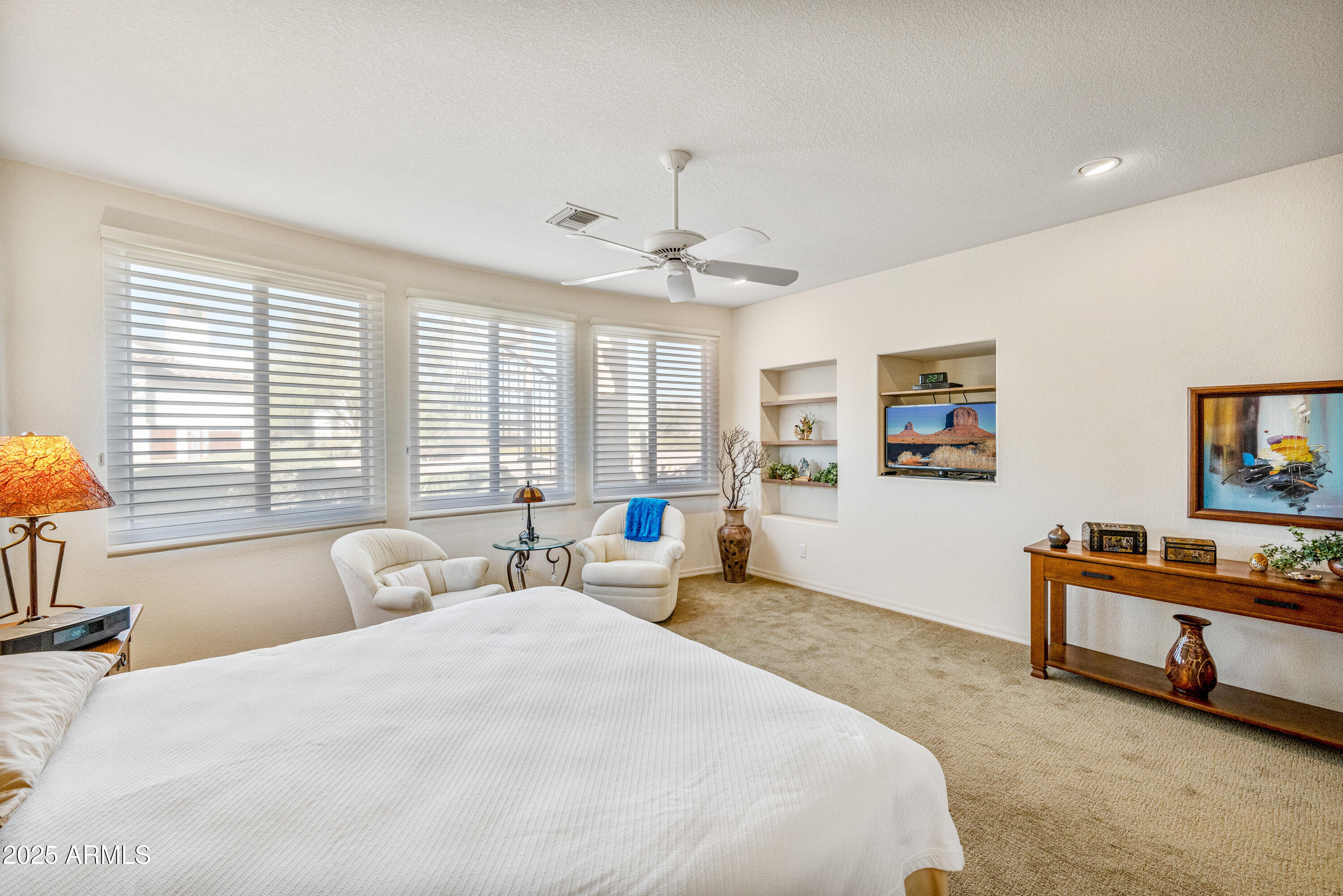 18300 North Tonto Verde Drive Rio Verde, AZ 85263 - Photo 16 of 35 a spacious bedroom with a bed a couch and a window