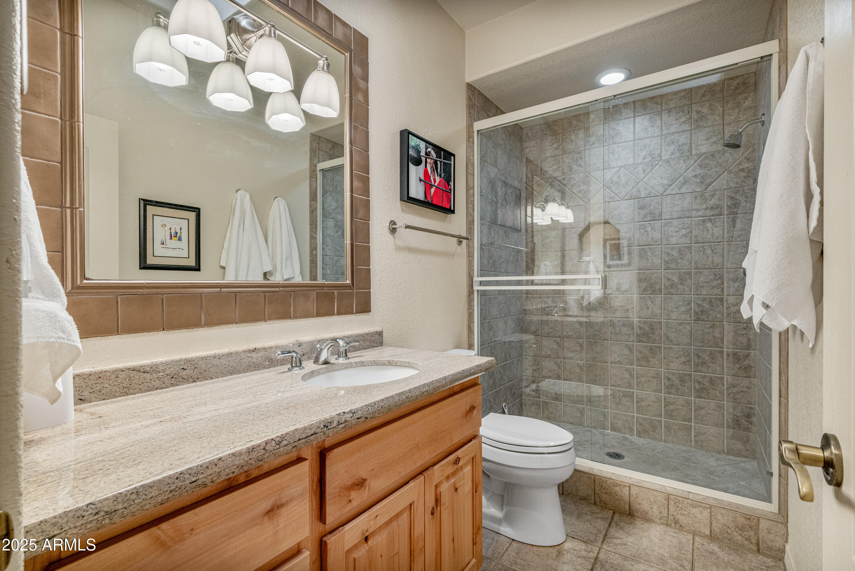 18300 North Tonto Verde Drive Rio Verde, AZ 85263 - Photo 24 of 35 a bathroom with a sink a toilet and shower
