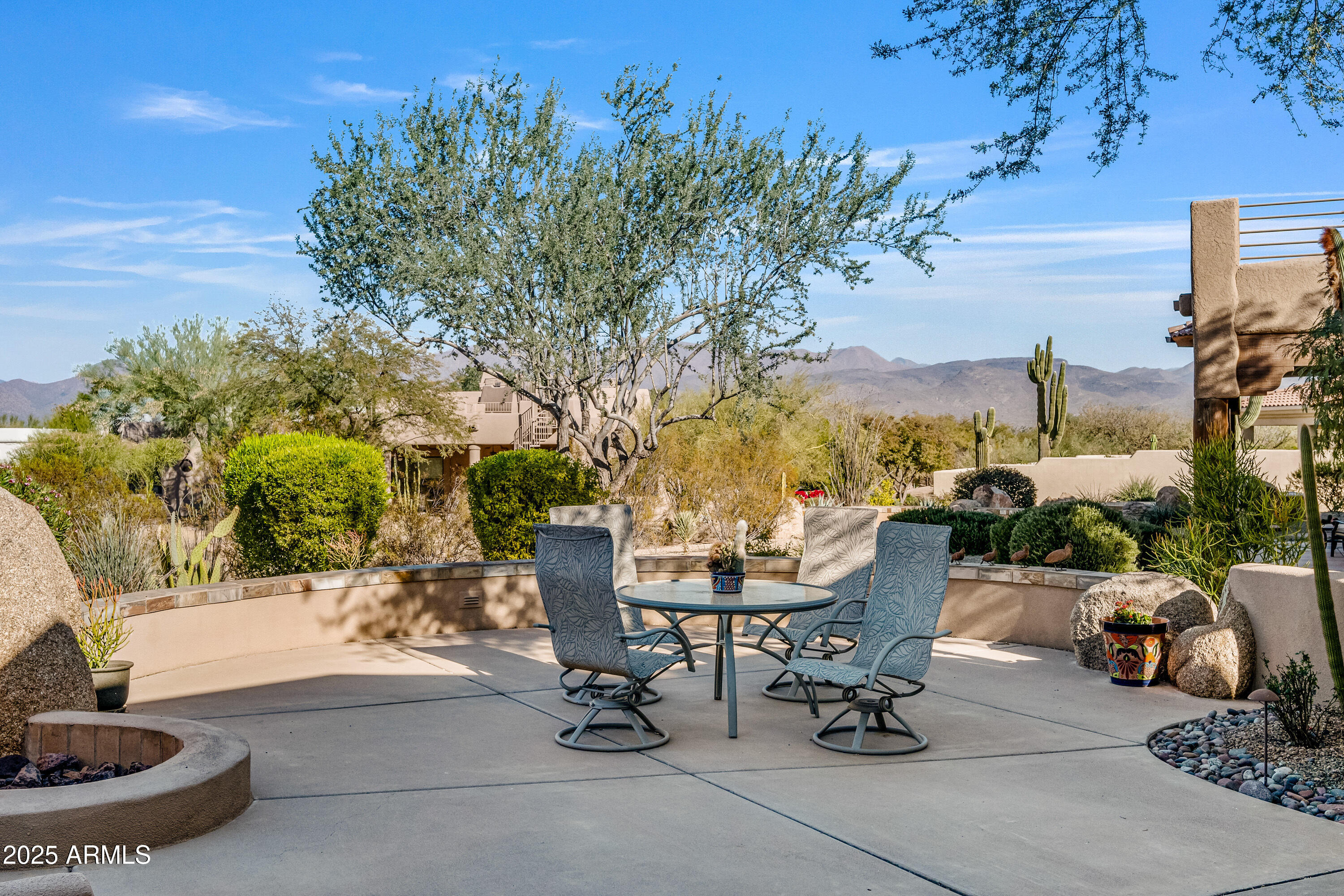 18300 North Tonto Verde Drive Rio Verde, AZ 85263 - Photo 27 of 35 a view of a patio with a table and chairs