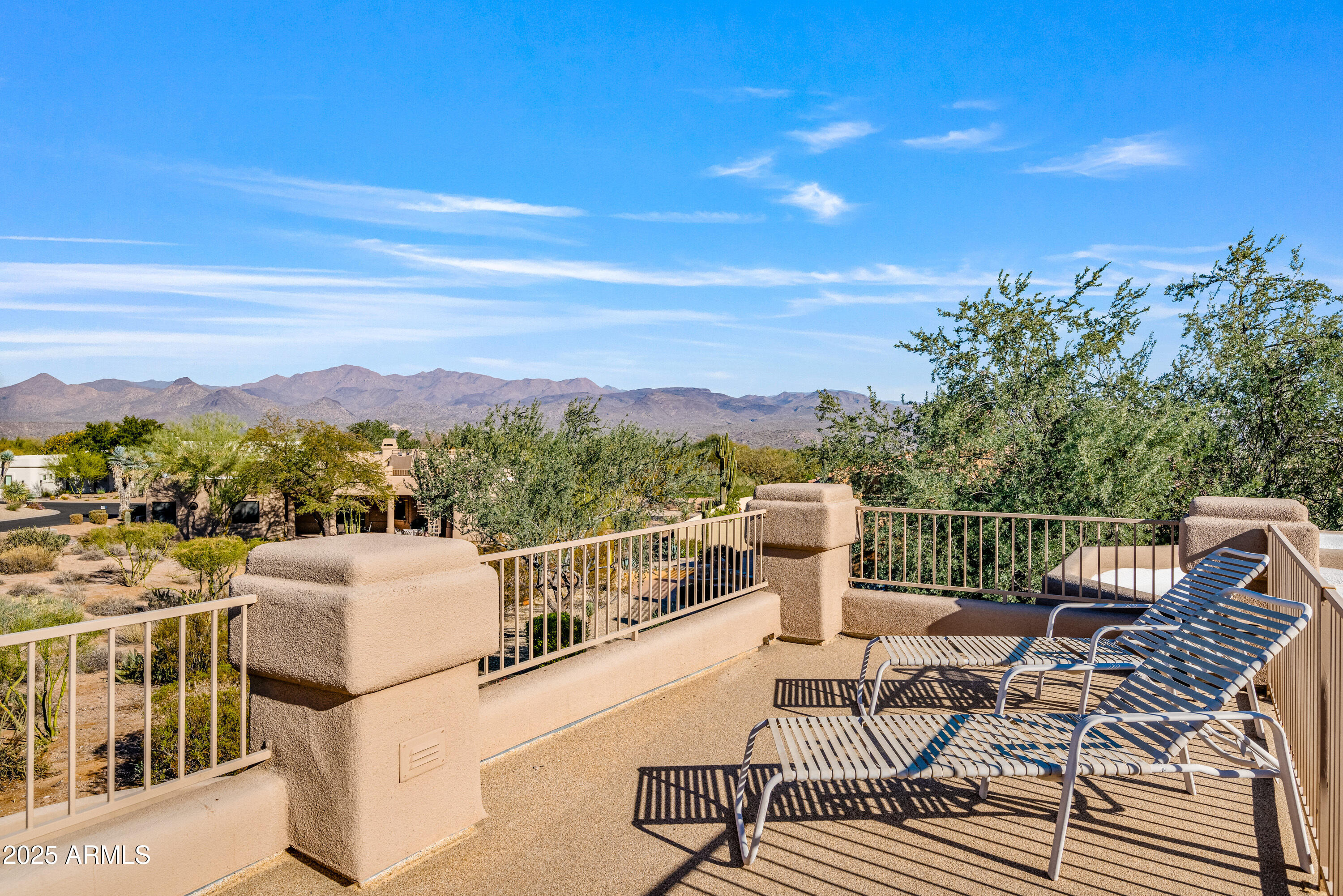 18300 North Tonto Verde Drive Rio Verde, AZ 85263 - Photo 32 of 35 a view of a balcony with table and chairs