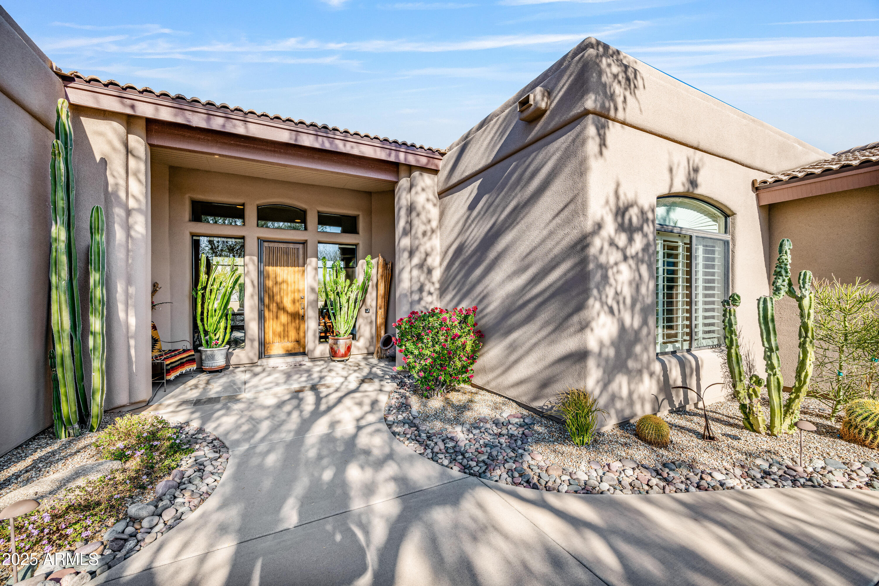 18300 North Tonto Verde Drive Rio Verde, AZ 85263 - Photo 5 of 35 a view of a house with a small yard plants and large tree