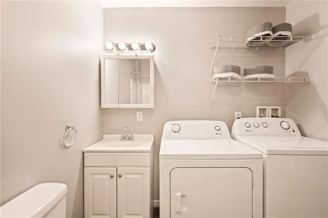 a view of bathroom with a washer and dryer