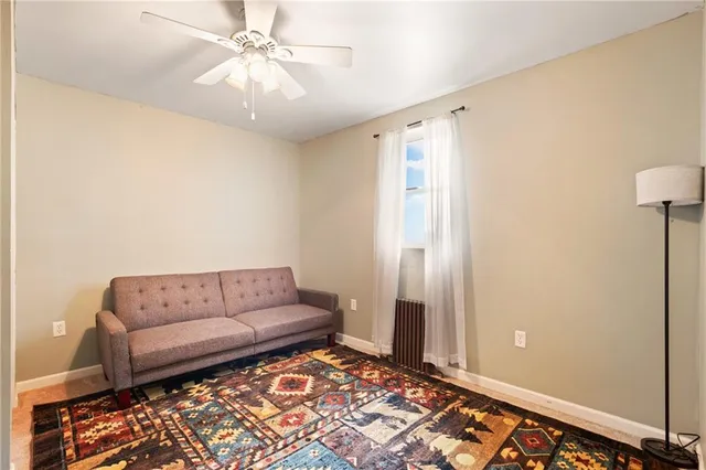 a living room with furniture and a rug