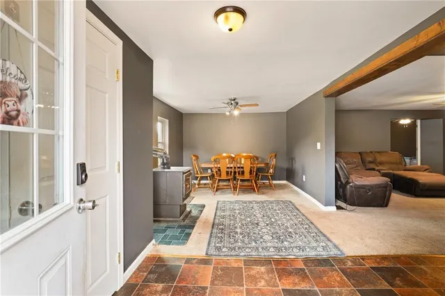 a living room with furniture and a rug