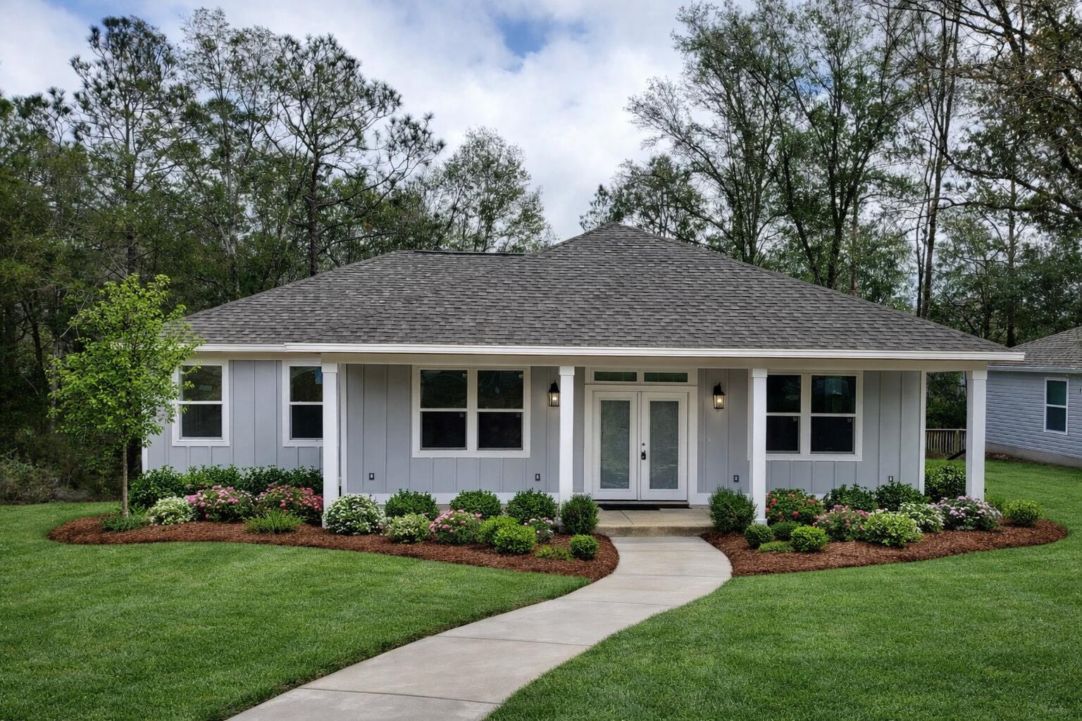 a view of a house with garden and yard