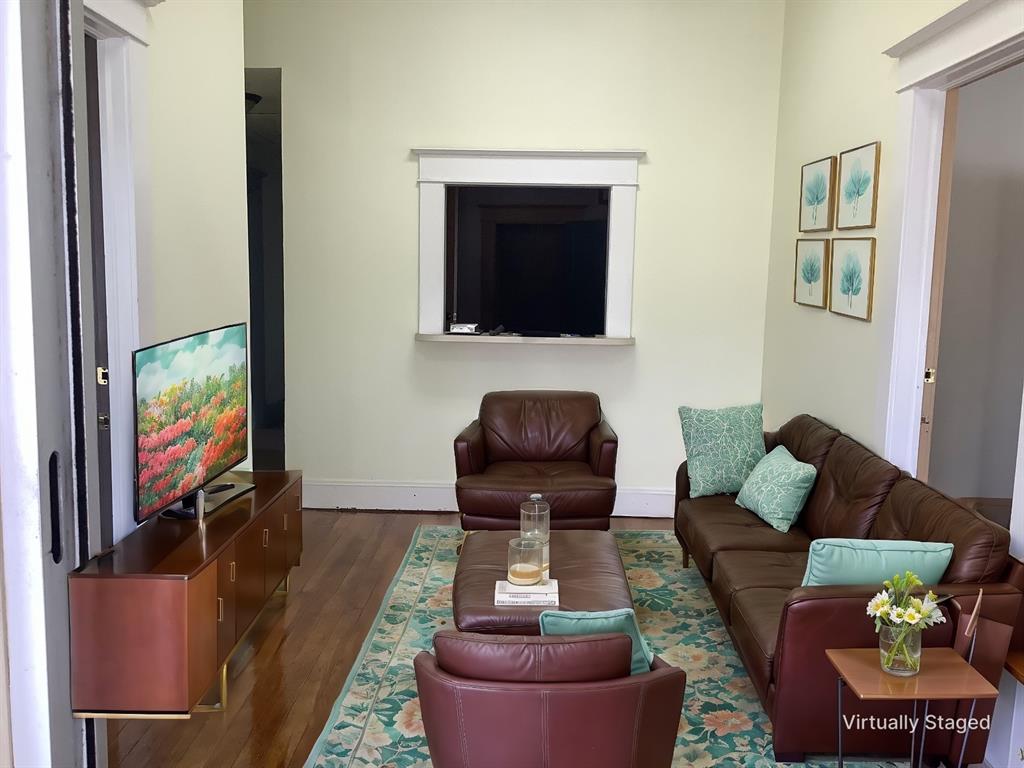107 Crosby Street Mansfield, LA 71052 - Photo 5 of 29 a living room with furniture and a flat screen tv